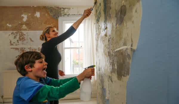 Mother and son decorating new home