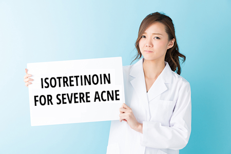 Doctor showing sign with Isotretinoin severe acne