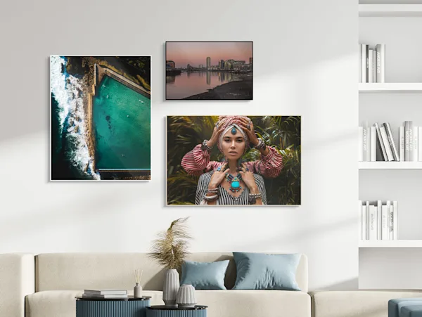 Several different motifs framed in a Solid Wood ArtBox on a wall in a living room.