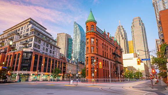 Toronto skyline featuring a terracotta building and skyscrapers.
