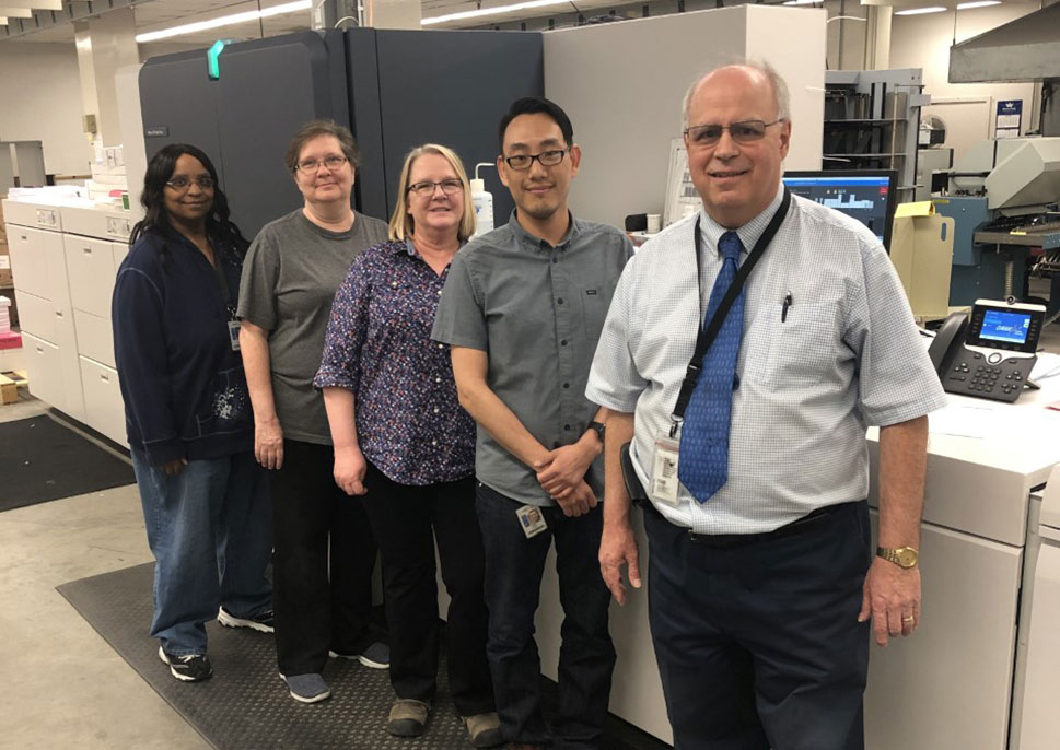 Employees at Omaha Public Schools with their Xerox Baltoro HF inkjet press