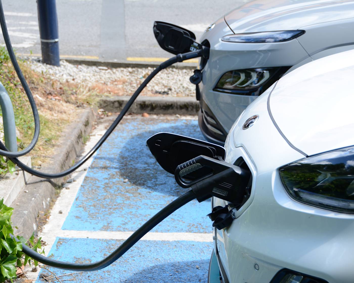 Two electric vehicles charging