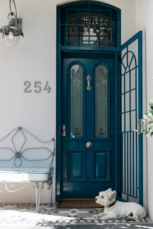 Blue front door on white house