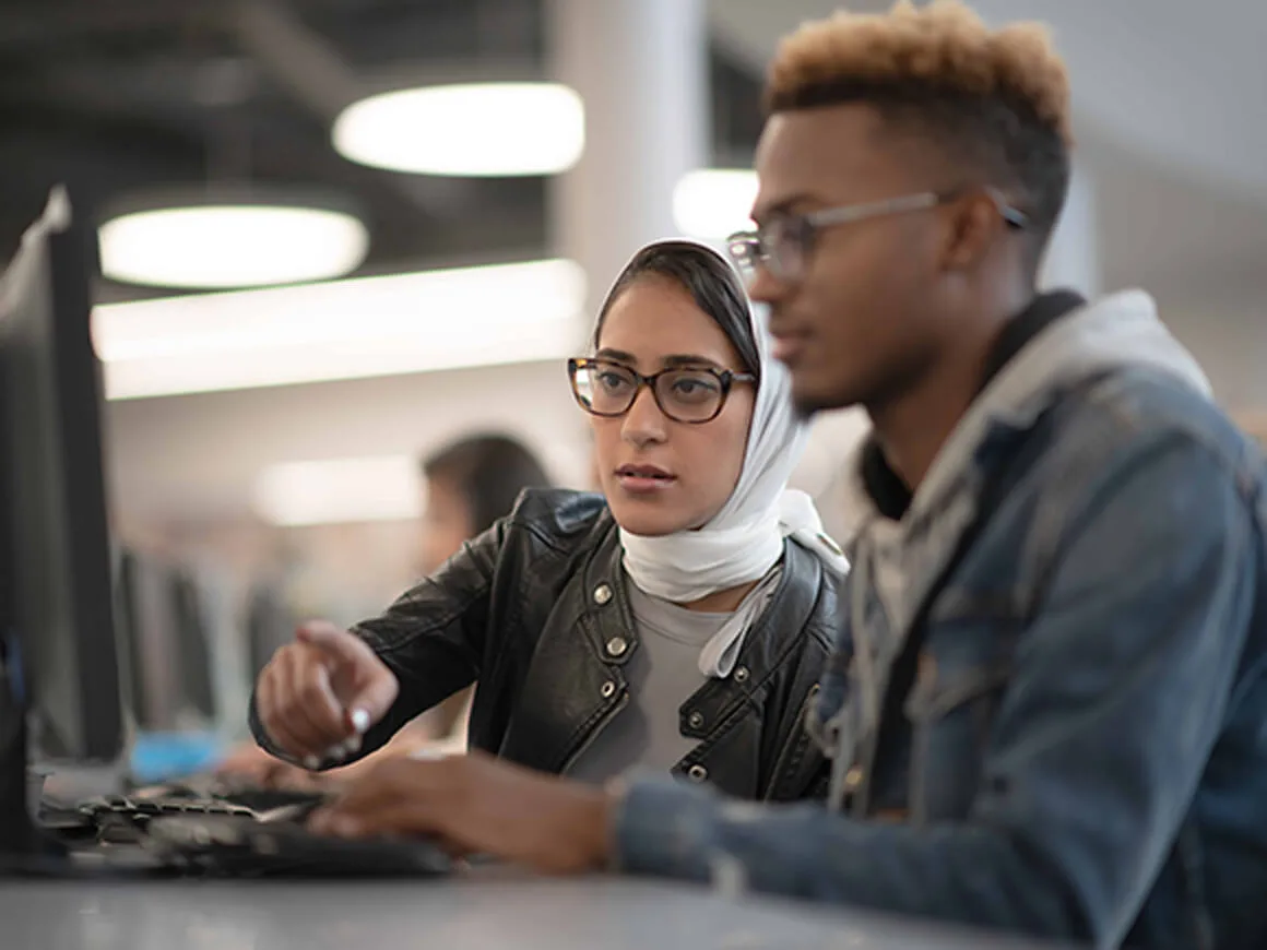 Students looking at monitor