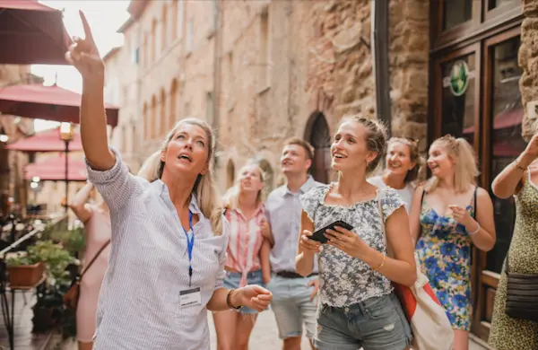 Tour guide explaining a building's cultural significance