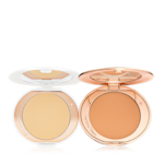 Airbrush Flawless Finish duo open Two, open, setting powder compacts with mirrored-lids and white and gold-coloured packaging, in banana yellow and clay-brown shades.