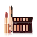 Supernudes Makeup Look open An open matte lipstick in a gold-coloured tube, lip liner pencil, double-ended eyeliner pencil in black and nude beige shades, and an open, mirrored-lid six-pan eyeshadow palette with matte eyeshadows in brown, peach, and beige shades.