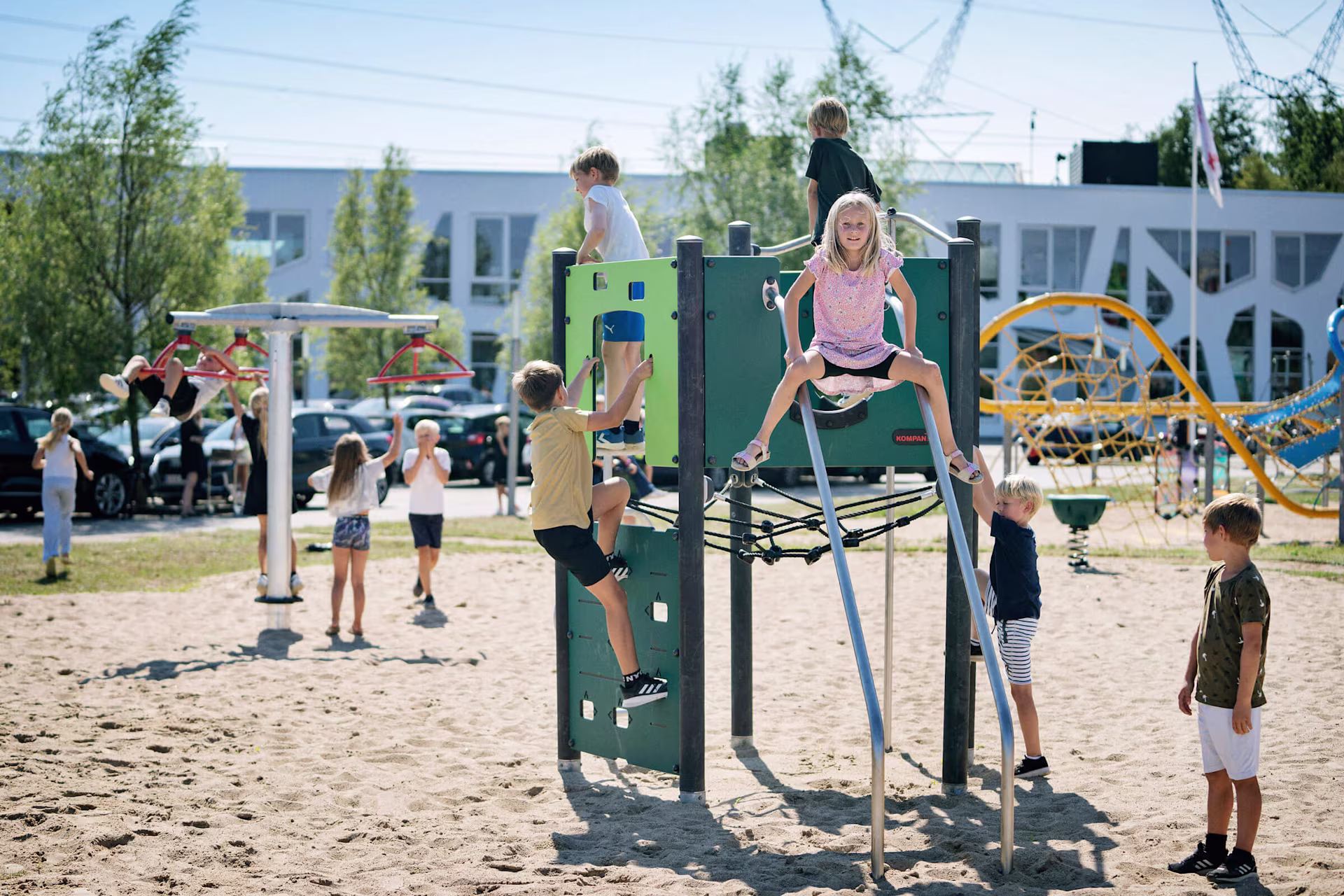 Children climbing on playground climbing structures at KOMPAN Denmark