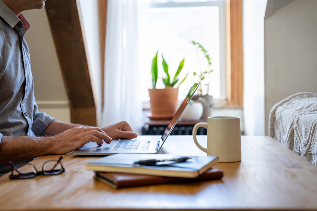 A man working on his laptop at home