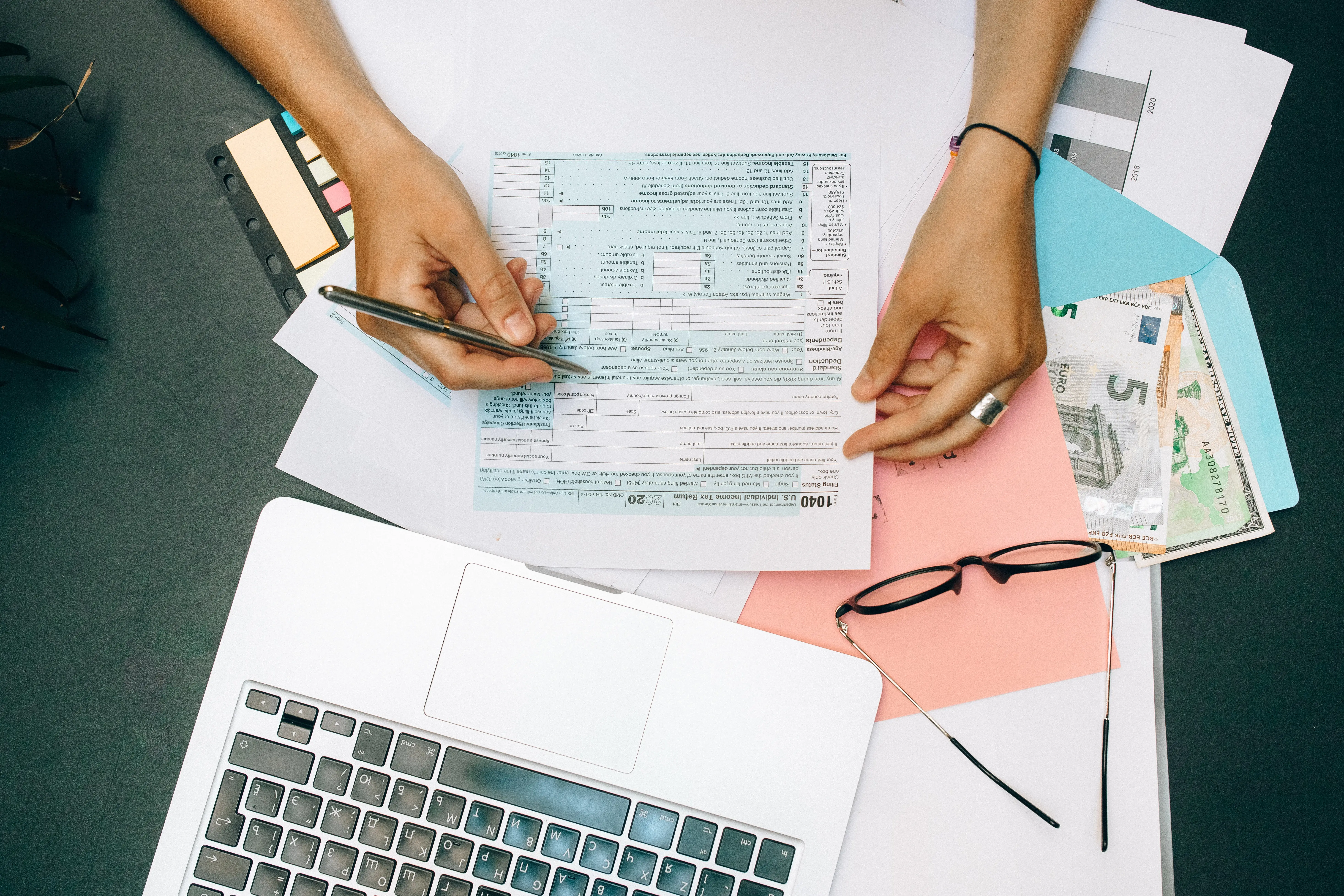 Someone fills out tax forms