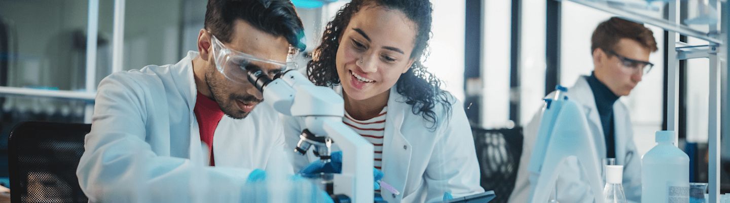 Students looking at a microscope