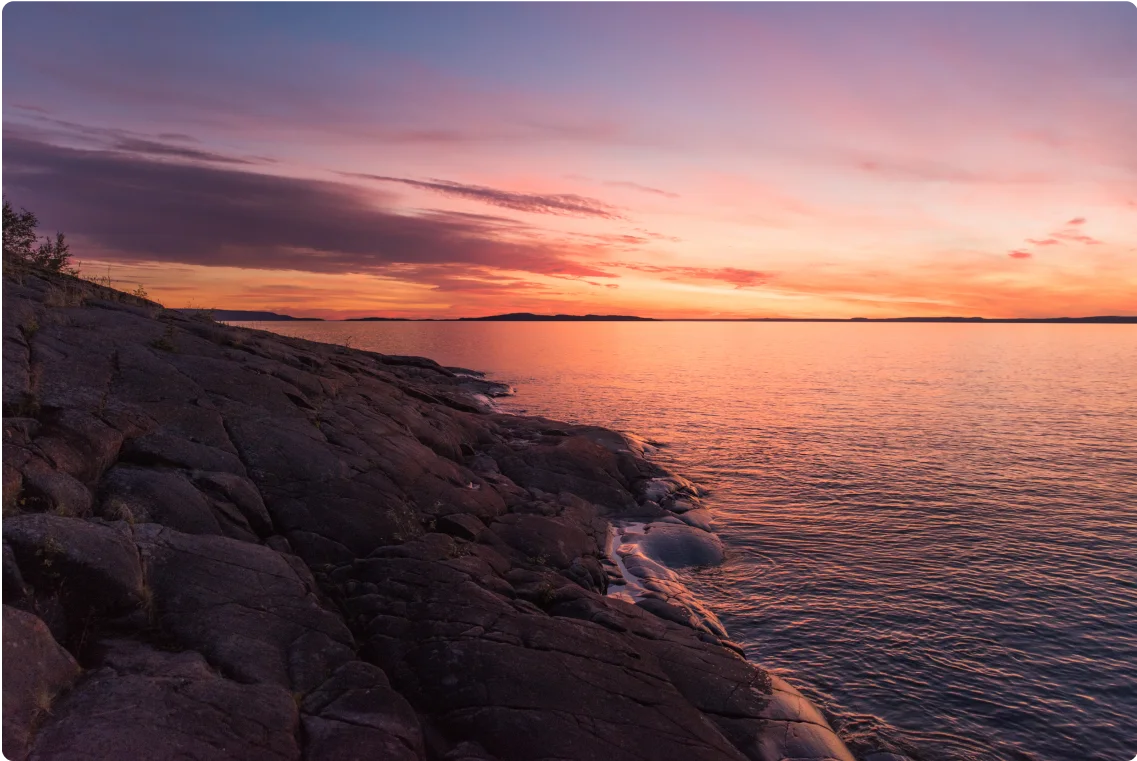 A landscape photo of Christie Bay at sunset.