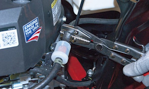 PHOTO: Clamp off the fuel line.