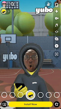 A Snapchat user tries on an AR Lens that places their face on a virtual avatar standing in an imaginary basketball court.