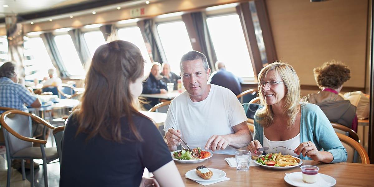 People enjoying food in a restaurant onboard DFDS Newhaven-Dieppe ferry Newhaven- Dieppe onboard restaurant