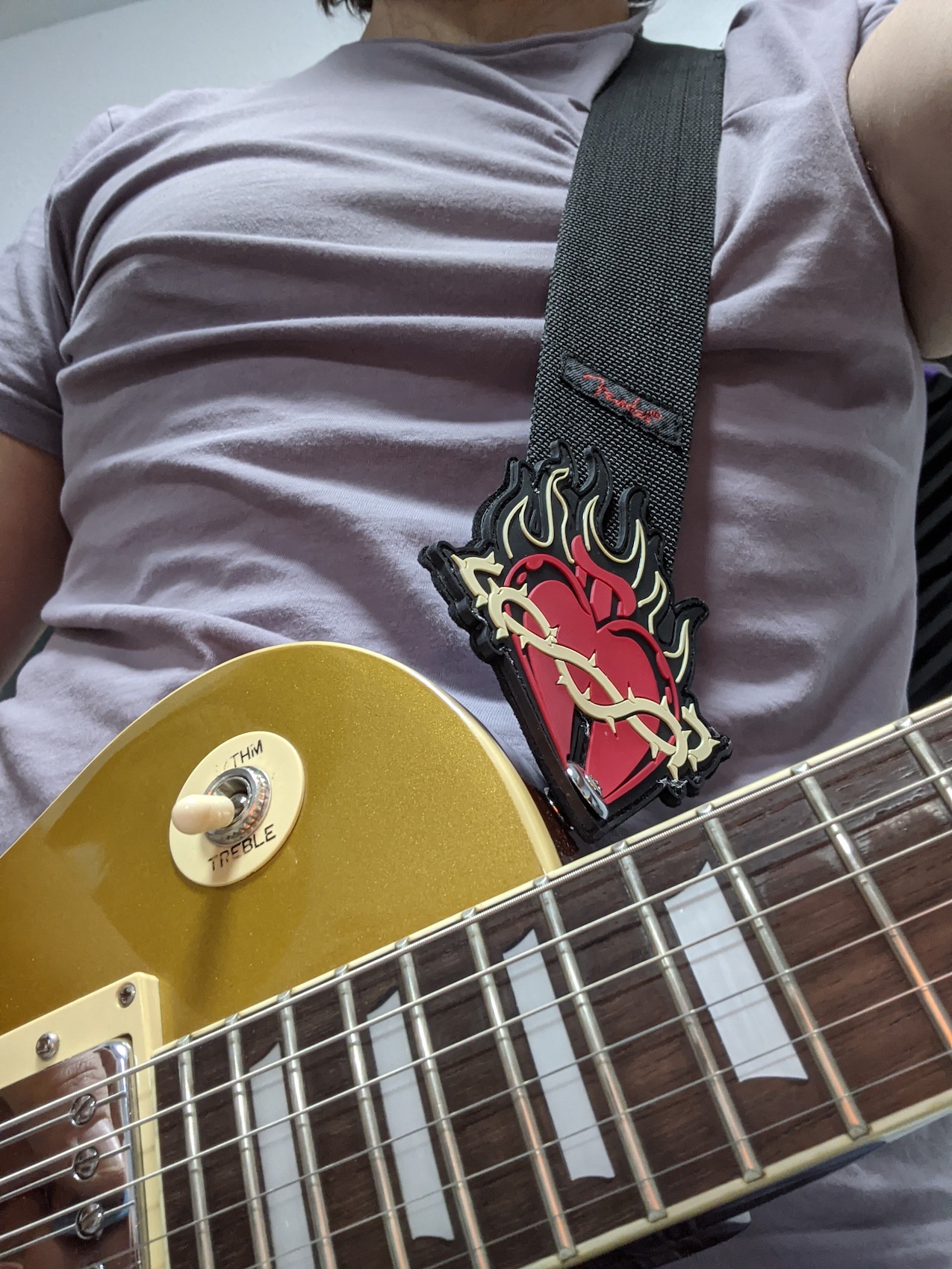 Photo of Miguel playing guitar