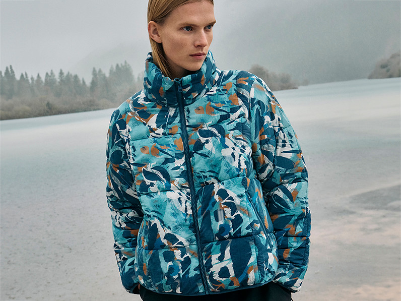 Woman wearing blue patterned padded coat