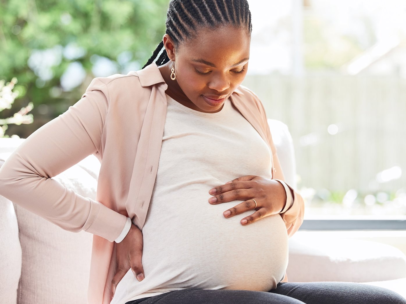 Woman holding pregnant belly