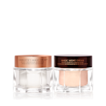 Pearly-white face cream in a glass jar with a gold-coloured lid and fawn-coloured night cream in a glass jar with a dark-brown-coloured lid.